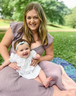 Katie Carpenter Instagram - we had a lovely picnic featuring my fave @hellyeahglutenfree treats 🍩 and FaceTiming with our mamas! 

Ryder came along too and isn’t 75 degrees the most PERFECT weather??! 

Cora is wearing a vintage dress made by my late grandma that I think I wore as a babe. 

And Kevin has been so sweet, he got me this beautiful birth stone necklace and printed out a poem that made me cry 🥹 (that we already spilled water on) 😂