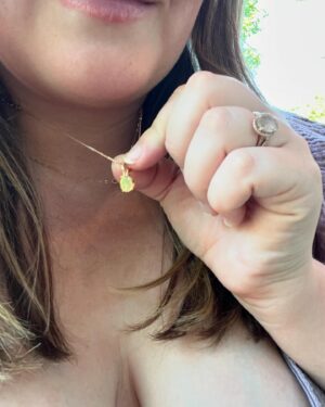 Katie Carpenter Instagram - we had a lovely picnic featuring my fave @hellyeahglutenfree treats 🍩 and FaceTiming with our mamas! 

Ryder came along too and isn’t 75 degrees the most PERFECT weather??! 

Cora is wearing a vintage dress made by my late grandma that I think I wore as a babe. 

And Kevin has been so sweet, he got me this beautiful birth stone necklace and printed out a poem that made me cry 🥹 (that we already spilled water on) 😂