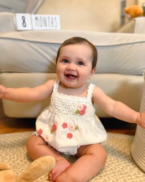 Katie Carpenter Instagram - 8 months (a day late!) 💖

Baby Cora has developed quite the personality lately. 

- she chats all the time 
- LOVES cheese more than life 🧀
- Enjoys sticking her tongue out 
- will show off her rolling outside of the crib, but only on the couch 😅
- Blows raspberries any chance she can get 
- Is eating 3 meals a day 
- can really put some dairy down and protests if we don’t serve her any 
- Kicking her legs in swim class more and more 

It’s so wild to see her preferences starting already! I remember when she was just a sleepy little lump, and now she’s closer to one year old than ever. It really does move fast!