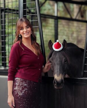 Katie Nehra Instagram - What’s your favorite part about Christmas? Mine is probably decorating the tree. (And putting tiny Santa hats on ponies)