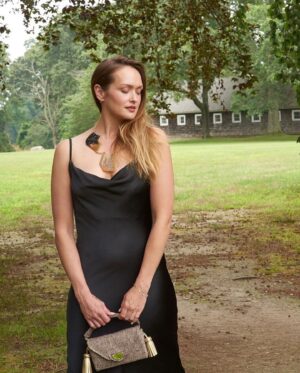 Kaylee DeFer Instagram - Embrace the elegance of darkness with this stunning black dress. 

Classic yet captivating, it's the embodiment of timeless style. 🖤 

📸: @lorinklarisphotography 
.
.
.

#blackdressmagic #eleganceinblack #timelessbeauty" #shelterisland #shelterislandny #shelterislandnewyork #summerinnewyork #newyorksummer #summer2023