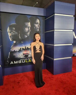 Kayli Tran Instagram - Would you risk it all if I was your bank teller? Officer Zach did. 💅

Lmao 😝 Catch me as Kim on Ambulance out in theaters Friday 4/8!

#ambulancemovie #michaelbay #asianactor #asianactress #dienvien #rescarpet #cutoutdress #blackdress