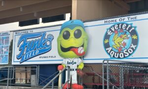 Kelsey Lewin Instagram - I’ve always wanted to sponsor a minor league baseball team and am incredibly stoked to have our little sign here at Funko Field for the @everettaquasox :’) maybe someday it can even be a big outfield sign! Go frogs! 🐸