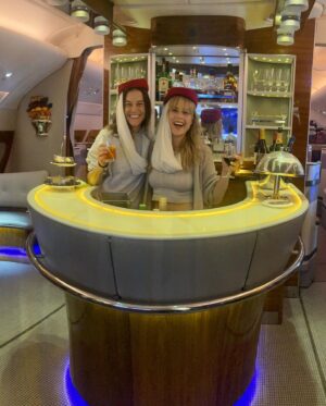 Kimberly Caldwell Instagram - Our Sex and The City moment on @emirates sipping cocktails in the lounge with Axel Rose! Can’t make this shit up. See you in Maldives Auntie Tunde ✈️ #sistertrip