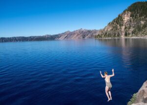 Kirsten Nelson Instagram - I met Dana and her sister as my daughter and I hiked down to the #craterlake caldera on our annual #girlstrip. This was a highlight for us as meeting people on the trail and talking to folks from all over the world brings joy to these travels. Recently we reminisced about the travelers that we met and chatted with and laughed with and cheered on on that little out-crop above the lake. Nature offers up these idyllic settings. It’s up to us to merely create connections and make lasting memories. For we are all connected and we can find common ground. Thank you to #DanaBenner for capturing this jump, this leap into the unknown (which might have blown off my suit…) If you’re looking for a photographer in NJ, give #DanaBenner a look!! Dana, you and your sister are forever connected to our story!