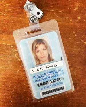 Kirsten Nelson Instagram - Keepsakes. Tokens. Relics. We keep (sometimes) tiny pieces that will float us back to recapture the smells and places and feelings of a moment. Of a breath. Of a time. Of lightning in a bottle…
Season 1 of @psychpeacock we wore badges in the station. It look legit. We always had issues on where to attach them. Lapels? Pockets? Waistbands? In the end they were silly and stupid. So I have no idea why I kept this plastic faded badge. But 17 years later… I know where I’m transported to every time it tumbles out of my top dresser drawer unannounced, as if it knows when I need the soft reminder of lightning captured. IYKYK and IKYK 

Happy #Psych17. 💚🍍💚