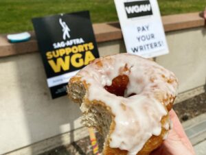 Kirsten Nelson Instagram - Today’s picketing, this time at Warner Bros. So much love and support on the line and from the honking cars, the morning shift flies by! Camaraderie! Stories! Purpose!! And a HUGE shoutout of THANKS to #NkechiCarroll for providing the downright SINFULLY DELICIOUS services of @hustlendough to sate the striking palate!!! 🫡🍩🪧💙