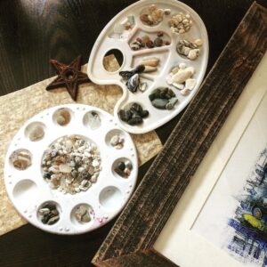Krista Sutton Instagram - Part 2 from yesterday’s post....well.... now it goes without saying we need to catalogue the beach treasures right? 😉 🤷‍♀️ 🌙 
Moonstones galore in the center of the round art palette and others by color, size, texture....oh and a sneak peek of my water piece.... 💦 🌊 #natureinspiration #creativityeveryday #palettes #creativemoms #beachtreasures #moonstones
•
•
#multicreative #actress #singer #illustratorlife #artlife
#penandink #watercolorandink #illustration #laactress #stylist #photostylist #homeinthestudio #handsandhustle #etsysellersofinstagram #etsyshop #eclecticdecor 
#showyourwork #illustratedart #mycreativebiz #whatwomencreate 
#artistmeetsmother #yourcreativeworkspace
#discoversomethingnew 
#carveouttimeforart