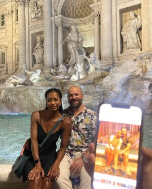 Kristen Ariza Instagram - We had 24 hours left and decided to end our European holiday exactly where it began 10 years ago. In Rome 🇮🇹We visited some old haunts and had pizza 🍕 at the first place we stopped way back when @darpoeta_trastevere We walked the streets til 3am which was exactly what we did when we arrived super jet-lagged back in the day, and had fun recreating some photos as well. Same scarf on my head (thanks Mom ❤️) and one of us has more hair, the other a bit less 🤔 Leaving here with a full belly, and a grateful heart to have made new friends, spent time with old friends and renewed vows with my Love @paddydemsey Til next time ✌🏾
.
.
.
#thenandnow #tenthanniversarytour #italy #glowup 💚🤍❤️ #keepsgettingbetter #pistolaoeople #romanholiday #graziegraziegrazie