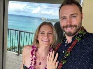 Kym Jackson Instagram - And theeen 6 months after we started dating - when your plans of proposing at burning man with a plastic electric glow ring @paultahoe and @brianaevigan found didn’t work out (I stole the ring from your bag because it was shiny and you couldn’t get reception to call my dad for permission) - you took me to Hawaii to “meet your parents”.

You proposed on the beach just after Sunset with a song you’d written the day before.. you remembered most of the words and made up the rest on the spot and it was absolutely perfect! 😻😻😻

My response was easy: “of course I will! Of course!!!”

#engaged #engagedlife #fuckyes #soulmates #bestfriends #storyofus #thestoryofus #hawaii #proposal #husbandmaterial #happiliyeverafter #kahala #kahalahotel #sheratonhawaii