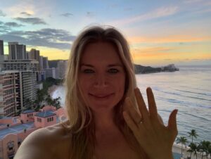 Kym Jackson Instagram - And theeen 6 months after we started dating - when your plans of proposing at burning man with a plastic electric glow ring @paultahoe and @brianaevigan found didn’t work out (I stole the ring from your bag because it was shiny and you couldn’t get reception to call my dad for permission) - you took me to Hawaii to “meet your parents”.

You proposed on the beach just after Sunset with a song you’d written the day before.. you remembered most of the words and made up the rest on the spot and it was absolutely perfect! 😻😻😻

My response was easy: “of course I will! Of course!!!”

#engaged #engagedlife #fuckyes #soulmates #bestfriends #storyofus #thestoryofus #hawaii #proposal #husbandmaterial #happiliyeverafter #kahala #kahalahotel #sheratonhawaii