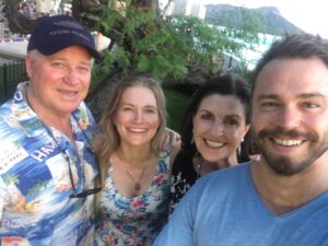 Kym Jackson Instagram - And theeen 6 months after we started dating - when your plans of proposing at burning man with a plastic electric glow ring @paultahoe and @brianaevigan found didn’t work out (I stole the ring from your bag because it was shiny and you couldn’t get reception to call my dad for permission) - you took me to Hawaii to “meet your parents”.

You proposed on the beach just after Sunset with a song you’d written the day before.. you remembered most of the words and made up the rest on the spot and it was absolutely perfect! 😻😻😻

My response was easy: “of course I will! Of course!!!”

#engaged #engagedlife #fuckyes #soulmates #bestfriends #storyofus #thestoryofus #hawaii #proposal #husbandmaterial #happiliyeverafter #kahala #kahalahotel #sheratonhawaii