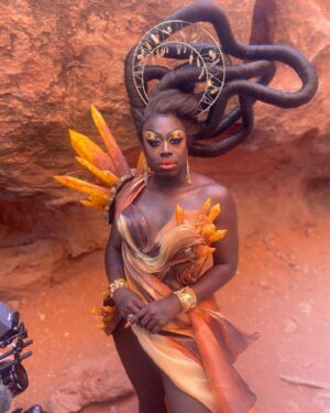 Laila McQueen Instagram - Last weeks stop on @werehere brought us to St George Utah, where we had one of my personal favorite entrance looks. 
The directive was mimic the organic nature of where we would be shooting and I’m just obsessed with what the whole team did to achieve this entire look. Very proud of all of us <3
-
The makeup I did is heavily inspired by the incomparable talents of @naezrahlooks - Truly one of the best makeup artist out there and have been in complete awe of their mind and work for years. 
Hair @wigsandgrace 
Outfit @realdominocouture