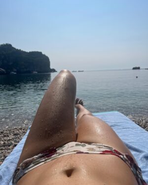 Lara Wolf Instagram - Couldn’t unhear the soundtrack of #WhiteLotus! Can you hear it? Also, cut me some slack for the imperfect #Bond girl walk, it’s a pebble beach 😂#taormina #beach #shannanigans #isolabella 
#laplagehotel #sicily