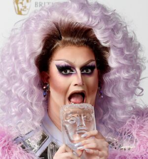 Lawrence Chaney Instagram - 18th MARCH 2021 - 3 YEARS!!!! 🎆🥳🎉🎊

3 Years ago, 24 year old (23 at the age of filming) Lawrence won RuPaul’s Drag Race UK. 🏁
I look back fondly to my memories on the set of Drag Race UK. I miss when Veronica Green used to fall asleep in the bath while styling a wig, I miss ordering 12 peoples worth of KFC just for me at the hotel. I miss Tayce spraying fake blood on my face. I look back and smile. 🤭💜

Watching it back, I’m proud of moments. Some less than others, but I’m glad I was at least myself 100% of the time. 🫣

Since Drag Race I’ve travelled the world and met so many amazing people and I couldn’t have done it with my family, Friends, RuPaul and World of Wonder. 

There have been ups and downs too, but life would be boring if it was all just perfect. 

I feel like everyday I grow, and I’m grateful to all of you for supporting me on my journey so far! I remember thinking because I had the shortest reign (8 months) no one would care after there was another winner. I thought I’d be the stuff of the past, and to some I am. But to those of you that stuck by me I’m so happy you’re seeing me at this time in my life. 

Love you all! 💜

Here’s to another 3 Years!!