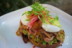 Lawrence Duran Instagram - Carnitas Eggs Benedict 
Grilled olive toast/ Guacamole/Carnitas/ Poached Eggs/ Cilantro hollandaise/ Pickled onions & jalapeños/ Micro Cilantro
.
.
.
.
.
.
.
.
#BreakfastOfChampions #MyEggsBenedictIsBetterThanYours #LatinFood #Breakfast #Lunch #Dinner #EggsBenedict #ChefLife #WahlbergChef #Family #Blessed