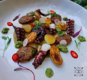 Lawrence Duran Instagram - Roasted baby Yukon’s/ Charred octopus/ Seared pearl onions/ Chorizo/ Quick Pickled Fresno’s & breakfast radish/ Citrus pea pesto/ Roasted poblano & cilantro white bean purée .
.
.
.
.
.
.
#FunWithFood #Chorizo #Pulpo #Simple #Delicious #Spanish #Appetizer #ImBack #PicOfTheDay #FoodPorn #FitFoodie #FitFam #IGDaily #InstaFit #IGFitness #InstaFood #Chef #PrivateChef #ChefLife #WahlbergChef #Blessed