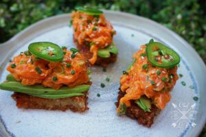 Lawrence Duran Instagram - Spicy salmon/ Crispy rice 

~Spicy Salmon~
8oz salmon
1 Tbsp kewpie mayo
1/2 Tbsp sriracha 
1 tsp chili garlic sauce
1 tsp sesame oil 
1/2 Tbsp soy sauce
1/2 Tbsp ponzu 
1 green onion (minced)

Dice salmon and mix all ingredients in a bowl

~Crispy Rice~
2 C sushi rice (rinsed until water runs clear)
3 C water
1 tsp salt 
1/4 cup rice vinegar 
2 Tbsp granulated sugar 
1 tsp sesame oil 

Rinse, strain and cook rice
Place rice into a mixing bowl while still hot 
Add salt, vinegar, sugar and oil into a microwave safe bowl and heat for 30 seconds or until the sugar and salt dissolves 
Drizzle liquid over hot rice and gently fold the rice
Spread on a sheet pan and place in refrigerator to cook for 30 minutes to an hour 
Cut rice into whatever shape you’d like and pan fry or deep fry until golden brown 

~Dipping sauce~
2 Tbsp rice vinegar 
1 Tbsp soy sauce 
1 Tbsp ponzu 
1 tsp mirin
1 tsp garlic chili sauce 
1 tsp sesame oil
1 green onion 

 Mix all ingredients in a bowl and set aside 

Top your crispy rice with avocado and spicy salmon mixture 
Garnish with sesame seeds, chives and a thinly sliced jalapeño 
Dip into sauce and enjoy!!

#spicysalmon #crispyrice #funwithfood #sushi #comfort #privatechef #wahlbergchef #family #blessed