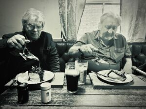 Louise Brealey Instagram - Dad and his friend Nigel came to our London screening of Chuck Chuck Baby on Saturday night. He put his hand on my arm at the end and said Well done, girl. Here he is eating a pie and using his walking stick as a microphone in the bar of the beautiful @thegardencinema in Covent Garden. #indiefilm #chuckchuckbaby #daddio