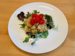 Lucy Luna Instagram - My own creation! Couscous with shrimp and cherry tomatoes over some greens. 🍤🥬 
Shrimp marinated with lemon, salt, pepper and a bit of paprika. Couscous made with olive oil, lemon, salt, and Italian seasoning. #chefskiss