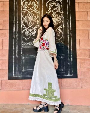 Luna Fujimoto Instagram - 日本語は下の方に。

I enjoy wearing traditional folk clothing in modern times, and I always look for these kinds of clothes when traveling. I bought these two pieces in Budapest, where I shot “Blade of the 47 Ronin.”

The Kalocsá embroidery vest is a traditional hand embroidery from the Kalocsá region of Hungary. It features colorful and bold floral patterns. The hand-woven dress, meanwhile, is from around eight or nine decades ago. It is in very good condition. The dress is from the Skopska Blatija region of Macedonia. 

Macedonian dresses with embroidery on the collar, sleeves and hem may be more popular, but I intentionally picked the one in plain white because I love Ainu (Indigenous people in Japan) embroidery so much that I was specifically looking for a suitable garment to embroider on. This dress is completely hand-woven and is made of 100% linen, so the fabric is very solid. The dress also has a real handmade quality to it. 

Later, I went to Hokkaido to look for someone who could do Ainu embroidery for me, but this turned into a long trip due to the fact that no one wanted to take something that was custom made. Then, by chance, I met @maki8477 in Nibutani who was willing to do it for me. I had almost given up, so I was really excited about it. She has a great sense of style!

👗🌸👗🌸👗

民族衣装を現代に着るのが大好きで、旅先でいつも探し歩き回ってしまいます。
この日に着用したのは、私が出演した『47RONIN-ザ・ブレイド-』の撮影地ハンガリーで購入したもの。

ベストはハンガリー・カロチャ地方の伝統的な手刺繍で作られた一枚。カラフルで大胆な花柄が特徴です。
手織りのワンピースは、北マケドニアのスコプスカ・ブラティヤ（Skopska Blatija）地方のもの。80～90年前に織られた一枚ですが、特にシミや汚れもなく、とても綺麗な状態です。

マケドニアのワンピースは襟元や袖、裾に刺繍が施されているのがとても素敵なのですが、あえて白一色のものをお迎えしました。というのも私はアイヌ刺繍がとても好きで、刺繍を施すのにふさわしい洋服を探していました。このワンピースは100%リネンで完全手織り。生地がとてもしっかりしていて、古き良き手作りを感じられる一枚です。

後日、アイヌ刺繡をしてくれる方を探すべく北海道まで行ってきたのですが、これがなかなか難しく…オーダーを受けてくださる方がいらっしゃいませんでした。
そんなときに二風谷で偶然出会い、快く引き受けてくださったのが @maki8477 
半ば諦めかけていたので、ほんっっとうに嬉しかったです！ワンピースの白さに合わせて、さわやかな緑色を選ぶところがセンスの塊！
そして実写版『#ゴールデンカムイ』の衣装も担当されています。私のオーダーは映画制作前でしたが、真紀さんが衣装担当だと知り、映画鑑賞時はこれでもかというくらい眺めていました。

#ainuembroidery #ainuculture #traditionalart #traditionalfolk #folkvibe #kalocsa #kalocsaembroidery #folkfashion #handembroidery #macedonia #embroidaryblouse #カロチャ刺繍 #民族衣装 #民族衣装好き #マケドニアの民族衣装 #ルーマニア刺繍 #伝統衣装 #アイヌ刺繍 #アイヌ文様