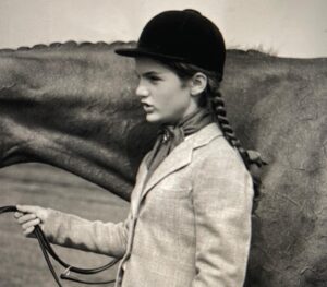 Maggie Egan Instagram - Be careful what Halloween Costumes you choose for your kids. 
The year John Kennedy ran for office my sister, Tracy Egan, the consummate horse lover, wanted (or did my parents ask her???) to go as young Jackie Bouvier Kennedy complete with riding jodhpurs , velvet riding helmet and a real riding crop. Me???
They dressed me up as a donkey! A DONKEY, y’all!!! 😂 It had an impact. Tracy went on to be a tv journalist and now works for the State of NY promoting racehorse farming in the State of NY.  And CLEARLY, I HAD to go into comedy! I had no choice. 🤷‍♀️
.
.
.
#lifesunfair #momalwayslikedyoubest #jackiebouvier #jackiekennedy #donkey #donkeycostume #whyme #donkeymascot #democraticmascot #whyiturnedtocomedy  #halloweencostumes