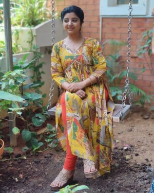 Mahalakshmi Shankar Instagram - The vibrant yellow color and the floral pattern give it a fresh and lively feel. The fit and flare design is flattering and the detailing around the neckline adds a touch of elegance. Overall, it’s a beautiful and stylish outfit from @aditiboutique_attur that suits anybody very well.