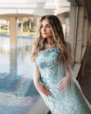Malak Ahmed Zaher Instagram - "I don't know about you but I'm feeling 22" held up 22 years to put this song 😅
Couldn’t find better pictures cause as you can see it’s by the sea!!!! 🧜‍♀️🩵💙☀️

My amazing team✨: 

Creative / art director @mennakotbb 
Photographer : @kareem.muhamed 
Director&DOP: @ziad.raslan 
Videography: @alynegmm @_thefilmmakers 
Stylist : @mennakotbb 
Designer : @tayacouture 
Jewelry : @iramjewelry_ 
Makeup artist : @makeupbysalmash 
Hair dresser : @alfredandmina @alfredmakram 
Locations : @stregisnewcapital