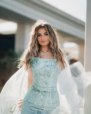 Malak Ahmed Zaher Instagram - "I don't know about you but I'm feeling 22" held up 22 years to put this song 😅
Couldn’t find better pictures cause as you can see it’s by the sea!!!! 🧜‍♀️🩵💙☀️

My amazing team✨: 

Creative / art director @mennakotbb 
Photographer : @kareem.muhamed 
Director&DOP: @ziad.raslan 
Videography: @alynegmm @_thefilmmakers 
Stylist : @mennakotbb 
Designer : @tayacouture 
Jewelry : @iramjewelry_ 
Makeup artist : @makeupbysalmash 
Hair dresser : @alfredandmina @alfredmakram 
Locations : @stregisnewcapital