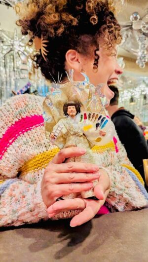 Marcy Harriell Instagram - The Blinging of Bob Ross…he’s got a ball to ride this weekend at @crisisbrewingco and obviously he needs to be as extra as the decorations 🪩
If you guessed the musical inspiration of @earthwindandfire you guessed right!
#bobross #earthwindandfire #drinkyourcrisis #dollclothes #newyearsoutfit
