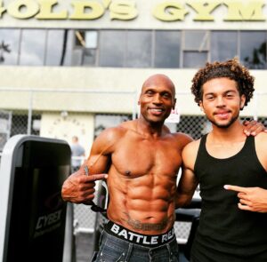 Mark Rhino Smith Instagram - Thank you very much @muscleandfitness  Link in bio.. for a fun interview @billdobbinsphoto @themsolympia  @goldsgym 🙏🏾❤️🙏🏾 Although my training has changed. #bodybulding will always have a special place in my heart. It taught me to put that work in 24/7 training, nutrition and recovery. Keep moving forward everyone @thegymvogue 💯 Thanks son @brodietyyoungsmith for rolling with your old man 🤪😂

#live
#life 
#health 
#love 
#fitfam