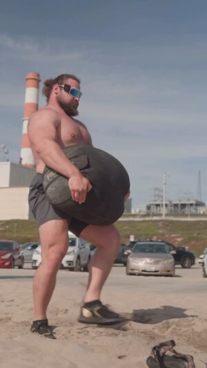 Martins Licis Instagram - Sandbag suicides are killller! Too many strongman competitors rely purely on barbell strength, and neglect that they are athletes when it comes to show day. Being able to move quickly, consistently, and without slowing down, is paramount to winning carry medleys! - with that said, I’ve got to do these more! I’ve been taking it very easy over the past few weeks to nurse my back, and it shows. This sandbag is the heaviest thing I’ve lifted in a while 😆 @theworldsstrongestman 

@romarkweiss