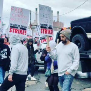 Mary H.K. Choi Instagram - #wgastrong 

Went to the union meeting last night and picketed this morning and I’m learning so much about how reasonable our asks are. 

For just one example we wanted parameters around AI. We’re not luddites. This isn’t some Y2K shit. We just don’t want idea generation from AI (doing a punch up on an AI script forever is NOT IT) and we don’t want AI to mine our voices, essentially learning from us, using us without permission or residuals to make us obsolete. 

Meanwhile the studios are saying they don’t want to preempt technology that they want to take advantage of and they countered with: we agree to annual meetings to discuss. 

Writing is taxing, lonely and for some of us the only fucking thing we can do and want to do with our lives. 

I’m not a joiner. I don’t like crowds. Confrontation makes me itchy but this is important. They’re making it impossible to make a career of this work. They want to make a gig economy of art. I cannot stand for it. So I stand with my union.