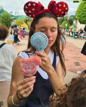 Matthew Okine Instagram - Spent the day at Tokyo Disneyland. Can't believe someone decided to "remake" this place 😂...

1. A sweaty old man (me) carries his daughter on his aching shoulders as she refuses to look at the camera.
2. Belinda, wearing red Minnie Mouse ears, tries to cool down using a portable fan and eating a mickey-mouse shaped strawberry ice block.
3. The "Go Coaster". Sofia's first rollercoaster. She loved it. We ended up going on it four times.
4.the view of Splash Mountain from the Rocky Mountain rollercoaster. Splash Mountain was a superior ride FYI.
5. A gourmet meal of soft drink, fries, and a sausage on a bone. There was also two mickey-mouse shaped pizzas hidden somewhere in this mix. They had corn on them though 😐
6. Mickey Mouse leads the most colourful float in the parade.