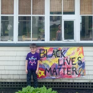 Matthew Wilkas Instagram - We painted a banner and nailed it to the front of the house! Gorgeous water color background by Johnny, letters my moi. LET’S TALK ABOUT IT WITH THE KIDS!!!! #blacklivesmatter