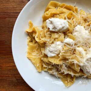 Megan Mitchell Instagram - Cacio e pepe is even better when topped with burrata. When it comes to cheese, more is always better. Recipe👇🏼⁣
⁣
Ingredients:⁣
• kosher salt ⁣
• 1 pound pasta, whatever shape you prefer ⁣
• 1 1/2 cups pasta cooking liquid⁣
• 1/4 cup unsalted grass fed butter⁣
• 1 tbsp. freshly cracked pepper, plus more for sprinkling⁣
• 8-ounce block of Pecorino Romano or Parmesan cheese, freshly grated⁣
• 2-3 balls burrata cheese ⁣
⁣
Directions:⁣
⁣
• Bring a large stock pot of water to a boil. Liberally season with salt. Cook the pasta per package directions until al dente reserving 1 1/2 cups of the cooking liquid before draining the pasta⁣
• Drain pasta and set aside⁣
• Bring the pot you cooked the pasta in (now empty) up to heat over medium low. Add in the butter and pepper and cook until melted⁣
• Next add in 1 cup of the pasta water, along with the pasta and freshly grated cheese⁣
• Cook, stirring constantly, until the sauce has thickened and is creamy. Turn down heat and add more pasta water if it gets too thick⁣
• Taste for seasoning, adding salt if needed⁣
• Spoon some of the pasta into a shallow bowl, top with burrata, more grated cheese and freshly cracked black pepper