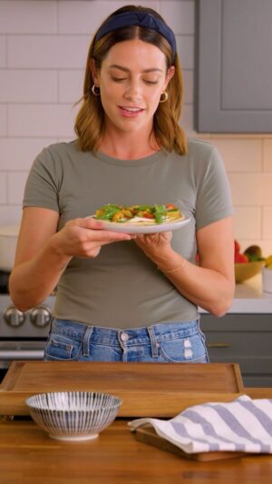 Megan Mitchell Instagram - When it comes to making bread at home, these flatbreads are about as easy as it gets. No yeast or long rest time needed. Topped with tangy feta, ripe tomatoes and fresh herbs. Another quick video I did for the @organiccenter. Recipe👇🏼⁣
⁣
Ingredients:⁣
• 2 1/2 cups AP flour*, plus more for rolling⁣
• 1 tsp. fine sea salt⁣
• 1/2 tsp. baking powder ⁣
• 1 1/2 cups @stonyfield Whole Milk Plain Yogurt ⁣
• 10 ounce feta cheese block⁣
• 1 medium lemon⁣
• 1 garlic clove, grated or finely minced⁣
• 1 pound baby heirloom tomatoes, larger ones quartered, smaller ones halved ⁣
• Kosher salt, to taste⁣
• Freshly cracked black pepper, to taste⁣
• EVOO, for drizzling⁣
• Thyme leaves, for garnish⁣
• Basil leaves, for garnish⁣
• Minced chives, for garnish⁣
 ⁣
Instructions:⁣
• To a large bowl add 2 1/2 cups of flour, salt and baking powder. Whisk together then add in the yogurt and mix with a wooden spoon or spatula until it comes together and forms a loose, shaggy ball⁣
• Scoop onto a floured surface and knead until it forms a smooth ball, about 5 minutes, adding flour little by little until it no longer feels sticky⁣
• Evenly divide the dough into 6 balls. Cover with a clean dish towel and let rest for 20 minutes⁣
• To a small food processor add the feta, lemon zest and juice and garlic. Blitz on high until smooth and creamy. If the mixture looks too dry, add 1-3 tbsp. of yogurt to thin it out⁣
• Pour into a bowl and set aside until needed⁣
• Bring a 10-inch cast iron skillet up to heat over medium⁣
• Take 1 ball and roll out to an 8x6-inch oval. Place into the hot skillet and cook 2 minutes per side until golden brown and puffed⁣
• Remove to a plate and cover with a clean towel to keep warm. Continue with the remaining dough⁣
• To assemble, slather some of the whipped feta onto a flatbread. Top with some of the tomatoes, a sprinkle of salt and pepper, a drizzle of EVOO and finish with a sprinkle of fresh herbs. Serve immediately⁣
⁣
*can be subbed in with self-rising flour, omit the baking powder⁣
⁣
#organicbenefit
