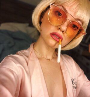 Megan West Instagram - The opposite of subtle
When I was a kid my family will tell you I never wore anything “normal”. Now when people ask me what I’m doing with my time. It’s this. 
Disclaimer: it’s a prop cigarette