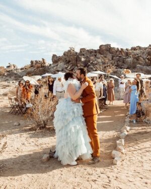Melanie Field Instagram - #OTMBride @melanie__field and Zachary Likins first matched on @bumble. 🐝 A year and four months later, he proposed while on a trip to see her family in Philadelphia. 💍 Once engaged, the couple agreed they wanted to share their love of the desert 🏜️ with their friends and family and get married in Joshua Tree. 
⠀⠀⠀⠀⠀⠀⠀⠀⠀
For the ceremony, Mel aimed to wear something unique. “I wanted to look and feel regal like a princess but from another universe,” the bride says of her wedding dress vision.🪐🛸💙👑 “And I knew I wanted tulle and lots of it, so I could just plop down on the ground in a pile of tulle. 
⠀⠀⠀⠀⠀⠀⠀⠀⠀
The bride found @millia.London and the label’s designer, Ruth, made her dream come to fruition. “As a plus size woman, I’ve spent most of my life feeling very excluded from high fashion. My experience with Millia London was not only lovely but healing in many ways,” Mel shares. “I didn’t have to settle on my special day, and I one-hundred percent felt like the wormhole space princess who fell from the sky—just like I dreamed I would.” 👰🏻‍♀️

#OTMWeddings #OTMExclusive #DesertWedding #CaliforniaWedding
⠀⠀⠀⠀⠀⠀⠀⠀⠀
📷: @wearemattandjess
Planning: @yuandus
Beauty: @angiebulmer @dear_shears
💐: @desertrose.creative
Catering: @mojavedesertcharcuteriecompany @sohotaco
🎶: @whosjondoe
🍰: @picnicbakedgoods