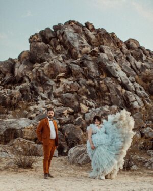 Melanie Field Instagram - Obsessed with Mel and Zach, their cosmic connection and their galactic, high desert wedding. The day was filled with so much color and love that we still feel it.

M   Z - Cheers to you, you magnetic humans. We ♥️ you.

Venue :: @themorada 
Planner/DJ :: @yuandus 
Decor :: @planksandpatina // @mtb_event_rentals 
Hair   MU :: @angiebulmer // @dear_shears 
Florals :: @desertrose.creative 
Bar :: @theboundlessbar 
Catering :: @sohotaco 
Cake :: @picnicbakedgoods 
Dress :: @millia.london 
.
#joshuatree #joshuatreewedding #ojaiphotographer #losangelesweddingphotographer #santabarbaraweddingphotographer