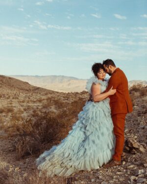 Melanie Field Instagram - Obsessed with Mel and Zach, their cosmic connection and their galactic, high desert wedding. The day was filled with so much color and love that we still feel it.

M   Z - Cheers to you, you magnetic humans. We ♥️ you.

Venue :: @themorada 
Planner/DJ :: @yuandus 
Decor :: @planksandpatina // @mtb_event_rentals 
Hair   MU :: @angiebulmer // @dear_shears 
Florals :: @desertrose.creative 
Bar :: @theboundlessbar 
Catering :: @sohotaco 
Cake :: @picnicbakedgoods 
Dress :: @millia.london 
.
#joshuatree #joshuatreewedding #ojaiphotographer #losangelesweddingphotographer #santabarbaraweddingphotographer