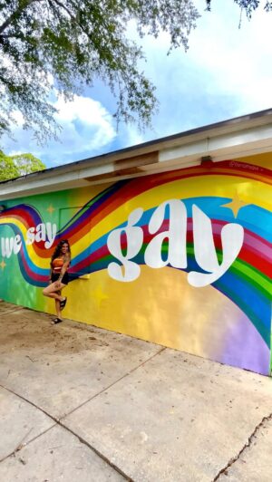 Melanie Posner Instagram - We Say Gay 🌈 
An endless thank you to @nonlecturekate who allowed the side of her house to be used to fight towards the injustice that is happening towards the LGBTQ  community in Florida right now. This beautiful human is the definition of an ally. This mural is located in St. Petersburg FL in a neighborhood where an elementary school is located. All of the school buses and car pool lines have to pass by everyday. For the kids who are finding themselves, the kids who have LGBTQ  parents, and the kids who want to grow up loving everyone authentically this was made for. 
Love is louder than hate 💅🏼 The gays will always conquer. I’m just getting started 🌈
#lgbtq #lgbtpride #gaypride #lgbtqartist #lgbtqart