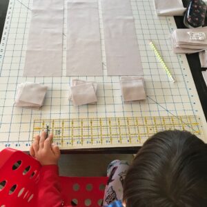 Meredith Monroe Instagram - #Saturdaysewing a new #project w/my fav #sewingbuddy 💙 he loves my #scissors aka #rotary #cutter he says they’re like #starwars like his #pjs I agree! Really I think he likes my #red @ikeausa #spin #chair😍 New #colorpalette #earthtones 1st ever  #solids quilt well I snuck a slight print in the background, couldn’t help myself looks like a solid though w/o my #glasses 😜love my @cathkidston_ltd case.  Happy memories of #London #cathkidston #pubs & friends.  Thanks Ki Still loving my #sparkly #patriotic #nails💖✨ reminds me of @clawstnt @janineshermanbarrois ⚡️