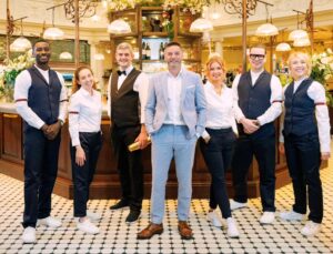 Merlin Griffiths Instagram - 🚨🚨NEW FIRST DATES KLAXON! 🚨🚨
2024 kicks off with #love and #laughter in the romantic city of Bath   new team mates, Aoife, Kofi and @jamie_mccleave 
.
@fred_sirieix is cantankerous as ever, @cici_coleman_ & @francesca.martusciello can't hold him back!
.
It all begins, January 2nd, on @channel4 ♥️📺🥂
@firstdates #FirstDates
.
 @twentytwentyproductions_ltd 
Photo: @paulgroom