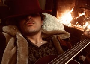 Michael J. Willett Instagram - Chillin’ by the fire with my 8 string