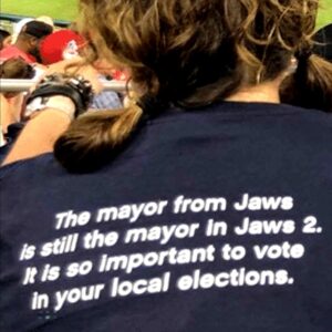 Michael Moore Instagram - Mike’s Midterm Tsunami Truth #24: 
Vote Local, Win National

Change begins at home—meaning right there in your neighborhood, your ward, your borough, your school district. It’s there where the crazies are trying to ban Maya Angelou. Where the Right is trying to stop affordable housing from being built. Where the Chamber of Commerce is trying to eliminate environmental regulations. Their mission is to stifle debate, to put a halt to change, to lock things down so that the big money in town calls the shots. That’s where the Ted Cruzes of this world get their start on the road to perdition. And if we don’t stop them there, they will one day become the next Marjorie Taylor Greene. 

So today I humbly beseech you to do a little research & find out who these local candidates are on your ballot. Look for a whip-smart local bartender (AOC) running for town council, or a middle school principal (Jamaal Bowman) on the ballot for County Commissioner or a local activist and mother (Cori Bush) seeking to become the township clerk. There are hundreds of these good people running across the country and it’ll feel good to find them, meet them and vote for them. The bigger changes that we seek nationwide begin right here in Our Town. 

As the t-shirt above says, the mayor in Jaws—the political hack who at the behest of the local business community demanded that the sheriff open up the beaches for that all-important tourism money-maker known as the 4th of July weekend (even though a mad shark who’d already killed a skinny-dipper was still lurking offshore)—by the time “Jaws 2” rolled around, this bastard was still the mayor! Proving unequivocally that if you don’t pay attention to your local elections, if we don’t do our duty as citizens, even in the “smallest” races on the ballot, there will be no night swimming left for any one. 

18 days to #Roevember! Spirits up!

I can’t make this victory happen alone. They only let me vote once! We’re all in this together.

Fear of the Trumpsters gives that power over to them. 

Believe in our collective power! 

What are you doing this weekend to get out the vote?! Now is the moment!

Read at MichaelMoore.com