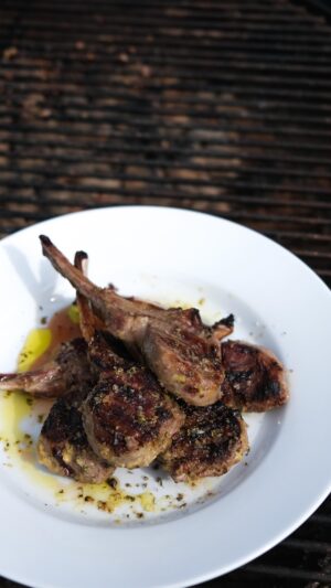 Michael Symon Instagram - Greek Easter is this Sunday… so you know we couldn’t forget the lamb. I like my lamb a little more on the medium side…. But you do you! Hope everyone enjoys…. 🍖 🇬🇷 ⬇️RECIPE BELOW! ⬇️ 

After I enjoy dinner with the family I’ll be tuning into #24in24 on @foodnetwork @streamonmax . Now that’s my kind of Sunday! 

Grilled Lamb Chops

Serves 4

2 garlic cloves grated
2 tbl oregano
Zest and juice of 1 lemon
2 tsp Dijon mustard
½ c extra virgin olive oil
12 bone in Lamb Chops
Salt and pepper
 
 
In a  large bowl mix garlic, greek oregano, lemon juice and zest, oil and salt and pepper.
Add the lamb chops and let marinate for 1-2 hours.
Remove from the fridge 30 minutes ahead of cooking. Fire up the grill, piling coals on one half of grill, leaving one side cool.
Sprinkle lamb with greek oregano and sea salt before placing on the hot side of the grill.
Reserve the marinade for basting the chops.
Grill approx. 3 minutes per side.
I recommend cooking to MR/Med.
Let rest 5 minutes and sprinkle with sea salt before serving.
