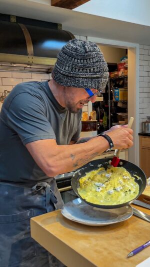 Michael Symon Instagram - Perfect, simple, cheater OMLETTE…works every time for those that hate the runny center .. if you like the softer center (which I do ) you can lessen lid time or omit completely 

EASY OMELETTE

4 large eggs
1 tbl OO
1 tbl butter

Optional 
2oz goat cheese or your cheese of choice
1 tbl fresh thyme or your herb of choice

Whisk eggs with pinch of salt until yolks and whites are fully combined
Place coated saute pan on high heat
Add eggs to hot pan, moving eggs around quickly and scraping down the sides while spreading the eggs around the pan
Turn off the heat, add the cheese and herbs to the top of the eggs
Cover the pan for 3 minutes
Hold pan at a downward angle and gently fold the eggs over on themselves to make a roll
Slide out of the pan onto a plate, sprinkle with salt and pepper
Enjoy