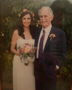 Michaela Watkins Instagram - Ok here we go. My dear ‘ol dad died suddenly last Tuesday. 

He was a brilliant mathematician, witty, stern, an avid outdoorsman, disciplined musician, lover of language, travel, his children his 2nd wife Brenda and her son , the grand kids (and as of a week before he died - his first GREAT GRANDSON) and all on the tightest budget he would allow himself to indulge. He was born on Passover and died on Passover. He was a practicing Jew and yet we both agreed on our disdain of Netanyahu and we both agreed on our love of hiking camping canoeing swimming arguing politics reading math games theater classical music and playing duets with me on piano and him on oboe and trombone. He was a unique guy who made us the oddballs we sorta are. 

He will be so missed by my sisters and me and especially by his wife Brenda whom he adored for 35ish years. 

He died abruptly and while jarring to us, it passed mercifully quick for him—doing what he loved. Walking on his favorite trail in Syracuse with his best friend, my sister, Sarah. A lover of birds and the symphony, donations if you felt like it could be made here: Audobon Society - New York, https://ny.audubon.org/ or The Syracuse Orchestra, https://syracuseorchestra.org/
Please leave Memories and Condolences on syracuse. com/obits