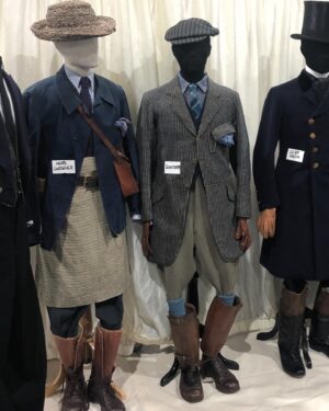 Michele Clapton Instagram - Polly’s costumes. I loved designing these! For the most part her costumes are relatively understated but the cut was key and I was lucky enough to have the genius Mel Carter as her cutter.  Gemma Arterton is wonderful to collaborate with and has such great posture and awareness of character. In the first fitting we discussed Polly and both agreed that we loved the idea of laced knee high boots being her signature item. They worked perfectly for the ‘action outfit’ but also gave the character a certain hidden strength even when dressed as staff. I wanted them to be in supple leather and to follow the line of the leg closely. I also wanted an elegant narrow cut to the toe, I wanted them to subtly elevate her station…The first look here with leather jacket and jodhpurs we actually see very late in the film, it’s a sort of revelation! I wanted it to be created out of period correct items but maybe worn in a quite racy way for women of the time, yet to be effortlessly stylish and practical. We had to make many copies of this outfit because of the cheese explosion scene..The next look here is Polly’s staff look. I didn’t want it too traditional yet it’s style would influence all of the other staff’s costumes so I had to be a little careful. I chose the colour palate of blues and pale grey which softened the usual black and white, and I dispensed with any frills, it seemed to be in keeping with my sense of Oxford and his late wife’s character.  In photo five we put together looks on stands to experiment as to how we might dress other members of staff within the same palate. The funeral suit ( fitting stage here) is very utilitarian with its bound edged patched pockets but beautifully cut. I adore the blue wool fabric  and brown binding together here. Finally I designed the green overall to delineate Polly’s different roles, so that when Conrad is finally shown the secret room we find Polly looking unlike her usual self..I thought this visually underlined his up till then exclusion.. assistant designer @sophie__oneill boots  @jitterbug.boy